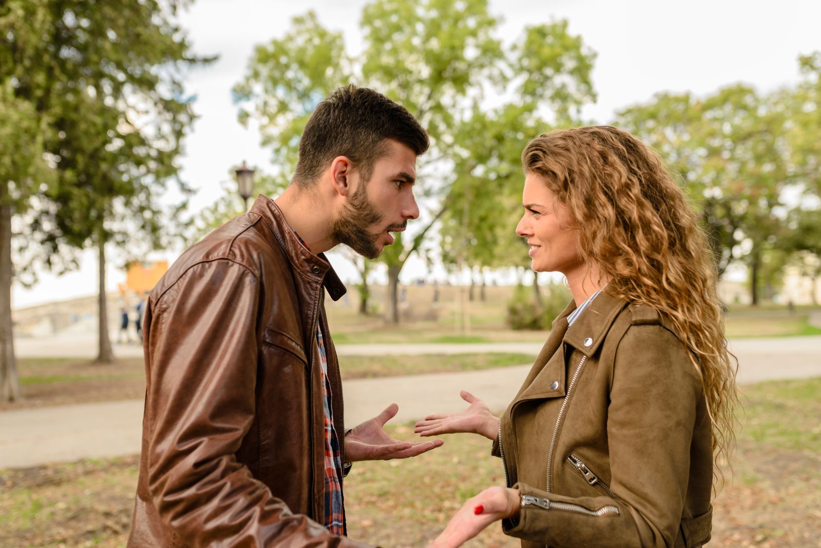Couple wearing brown leather jackets